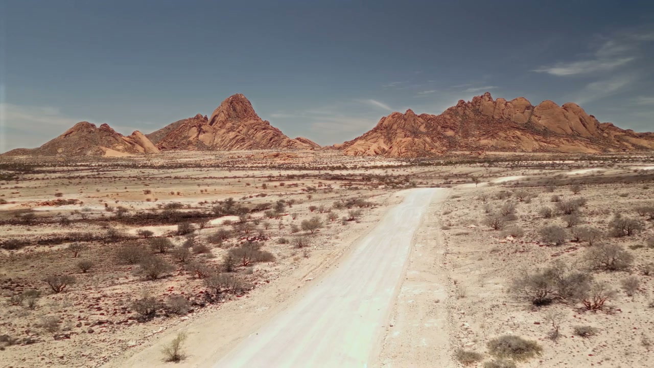 Dirt Road Leading to Desert Mountains