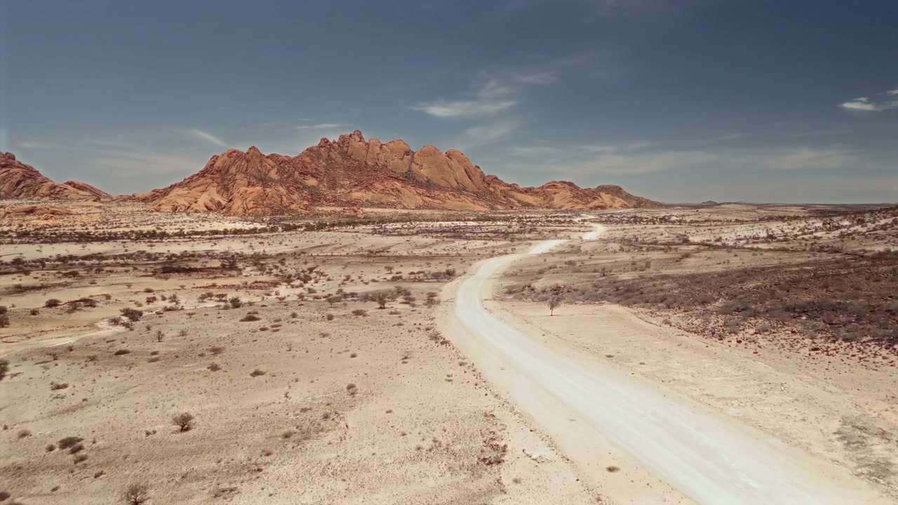 Desert Road Winding Through Arid Mountains