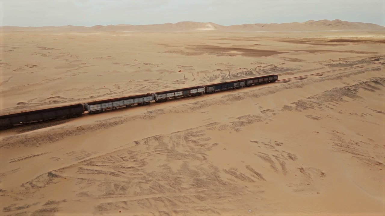 Freight Train Crossing Desert Landscape