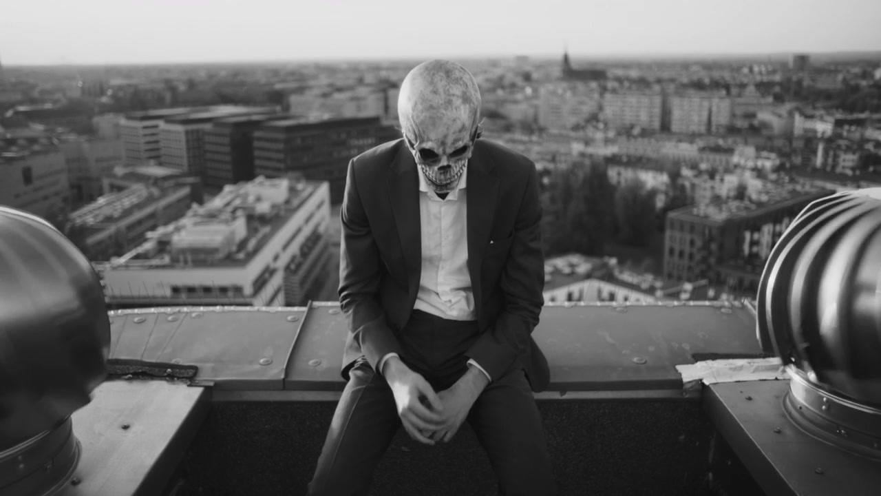 Person in Skull Mask on Rooftop