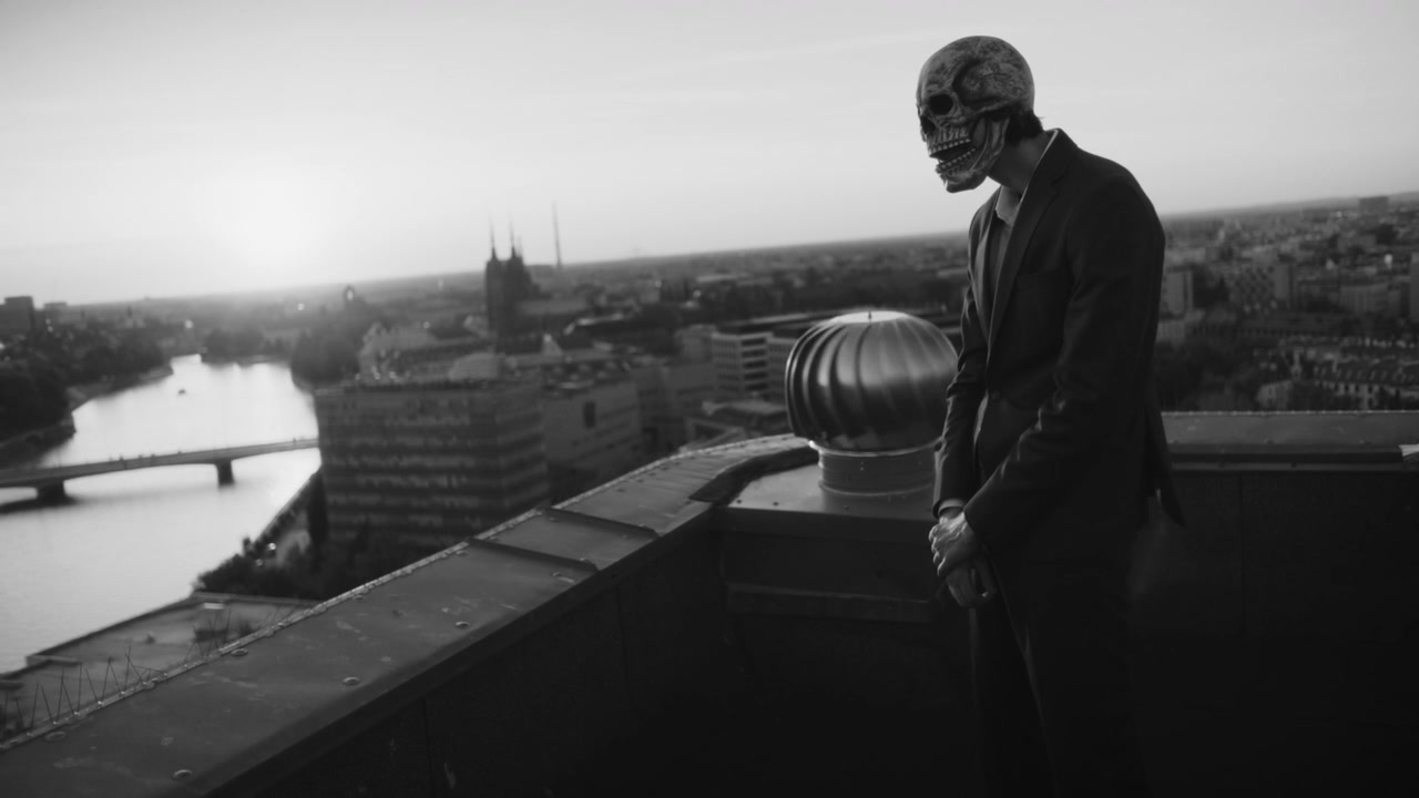 Skeleton Mask Figure on City Rooftop