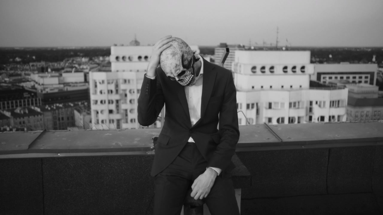 Despairing Skeleton Mask Figure on Rooftop