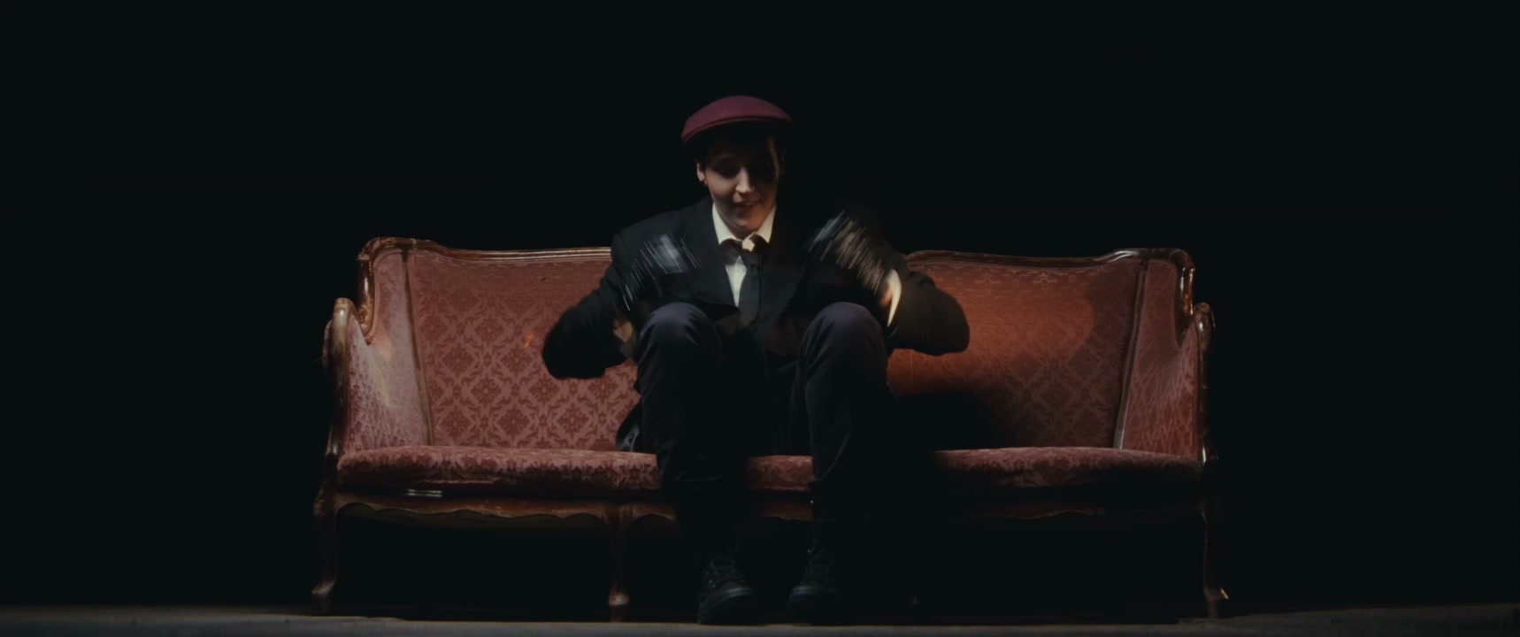 Mime Artist Juggling on Vintage Sofa