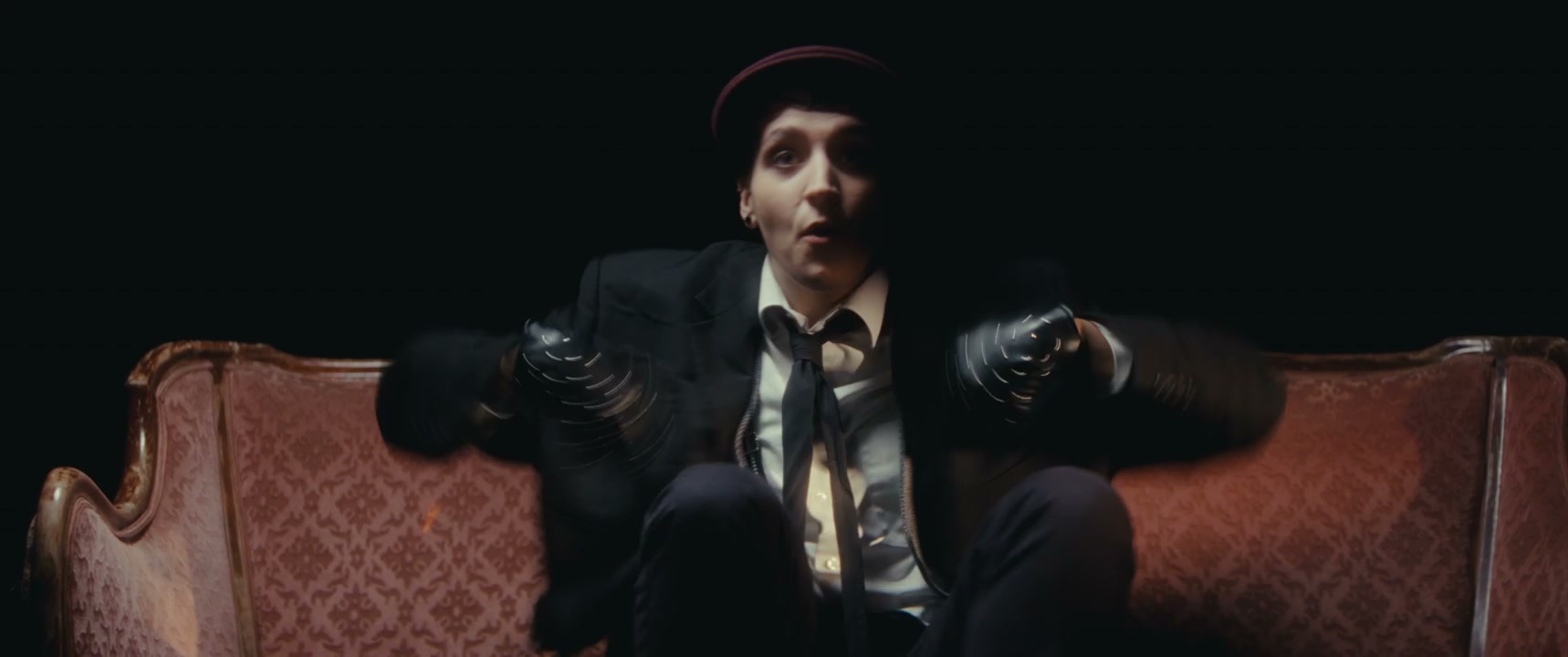 Mime Artist Dancing on Vintage Couch