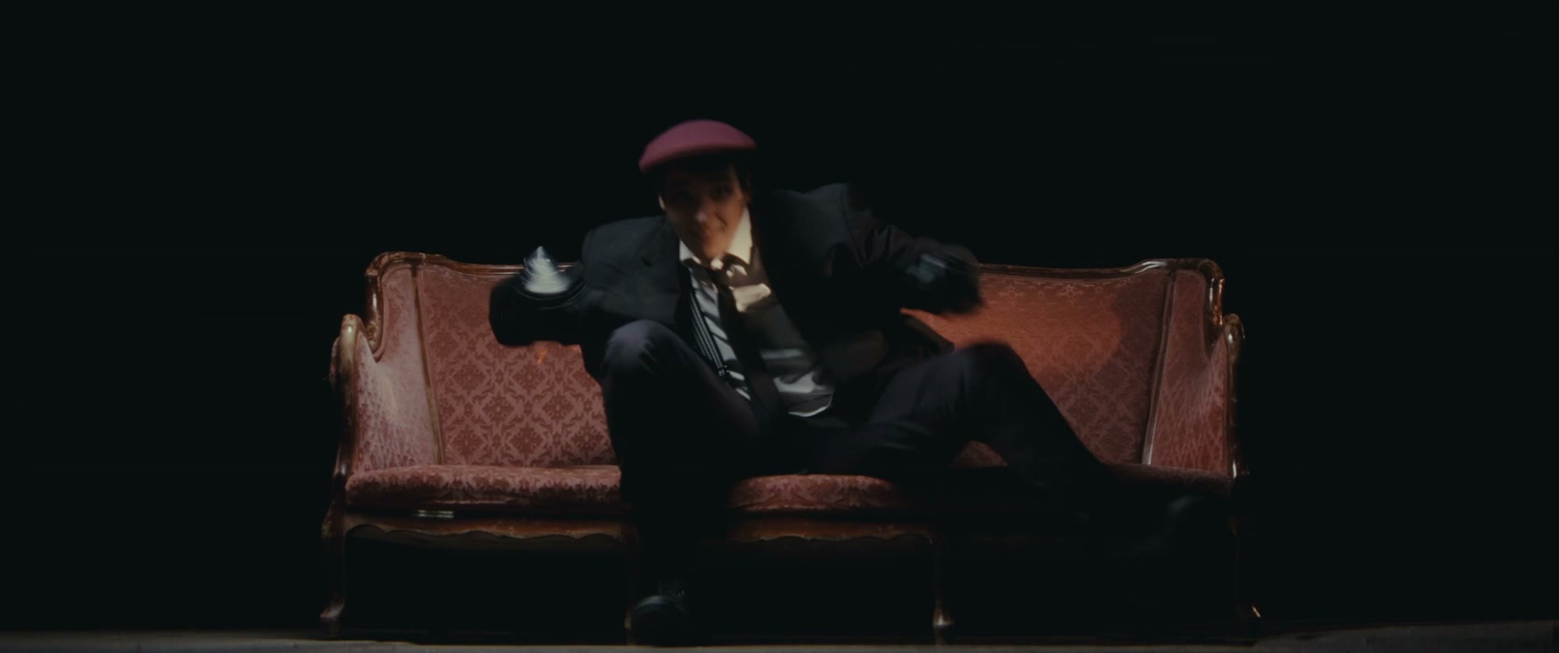Mime Artist Performing on a Couch