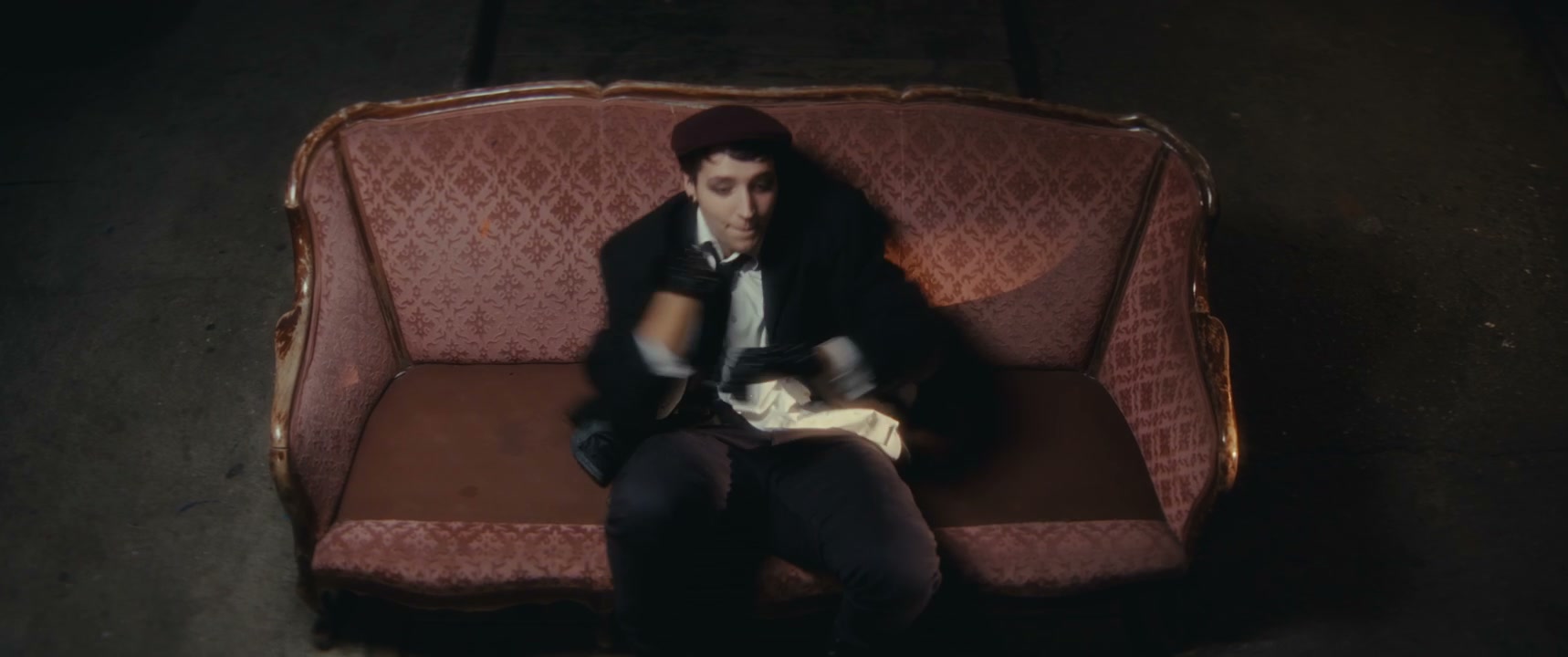 Mime Performer Dancing on Ornate Couch