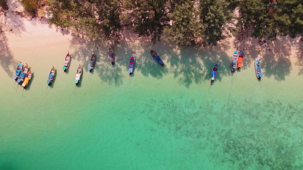 Longtail Boats Moored on Azure Island Shore