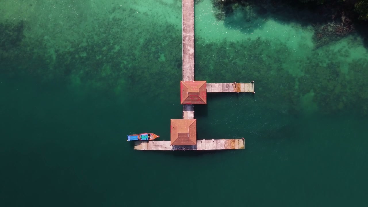 Aerial View of Tropical Pier with Boat