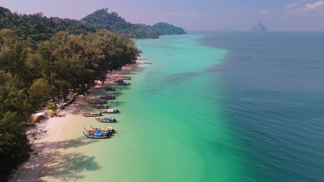 Azure Water Tropical Beach with Longtail Boats
