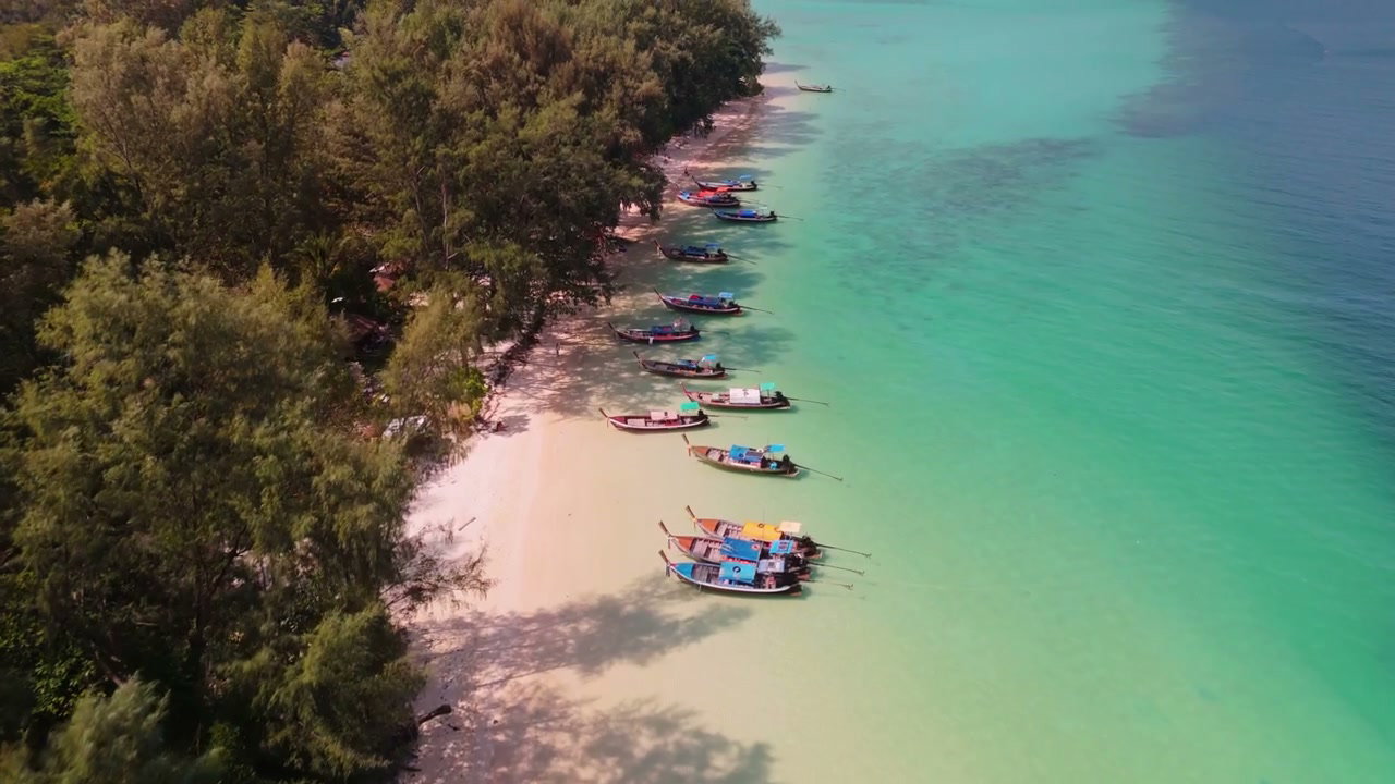 Longtail Boats Moored on Azure Island Beach
