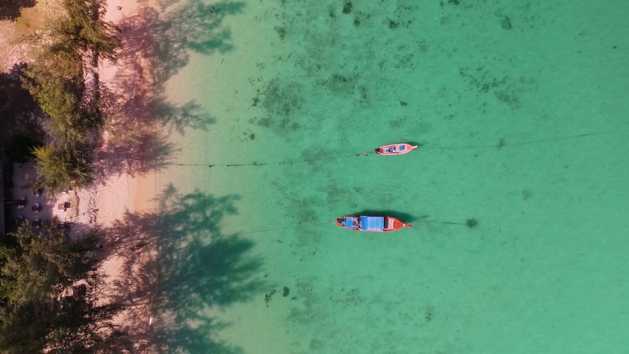 Tropical Beach With Boats Anchored