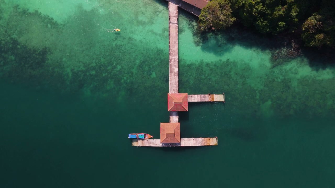 Tropical Island Pier with Clear Turquoise Water