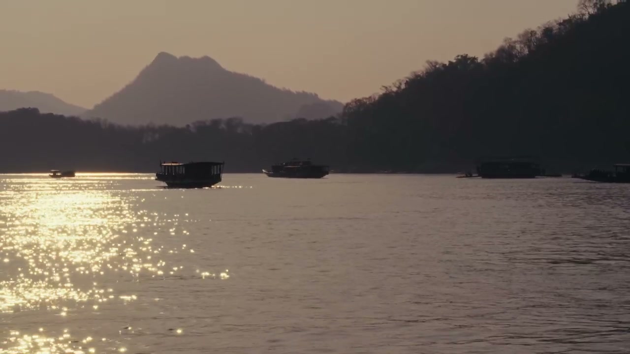 Sunset Over Mekong River With Boats