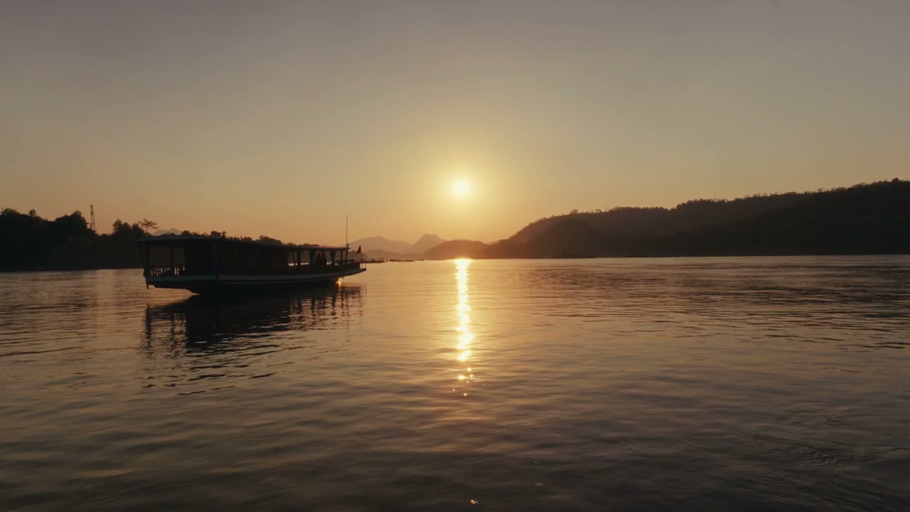 Mekong River Sunset with Traditional Boat
