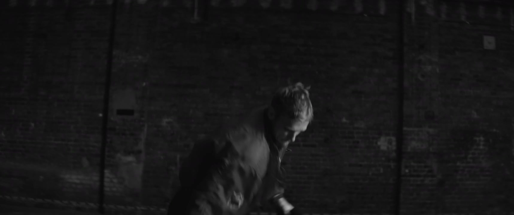 Breakdancer Doing Floor Work in Dark Room