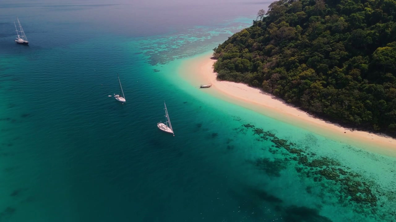 Aerial View of Tropical Island Beach with Sailboats