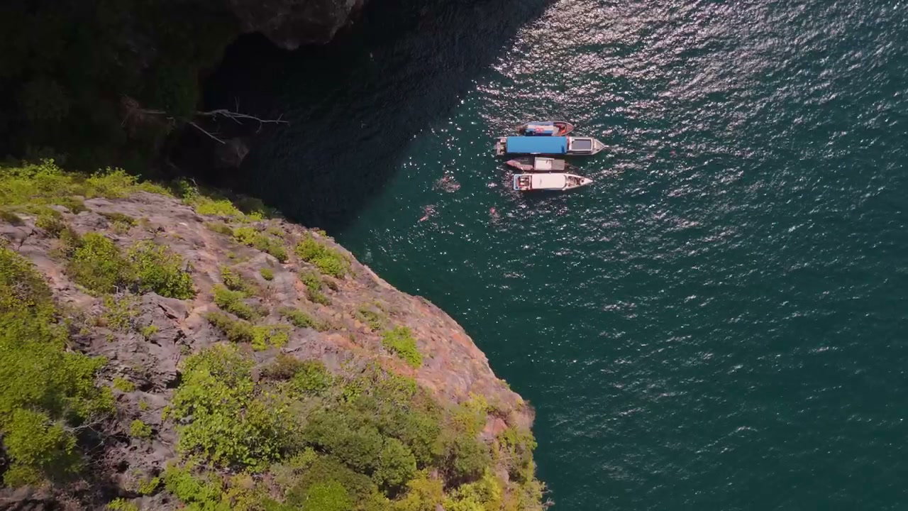 Aerial View of Boats and Swimmers in Thailand