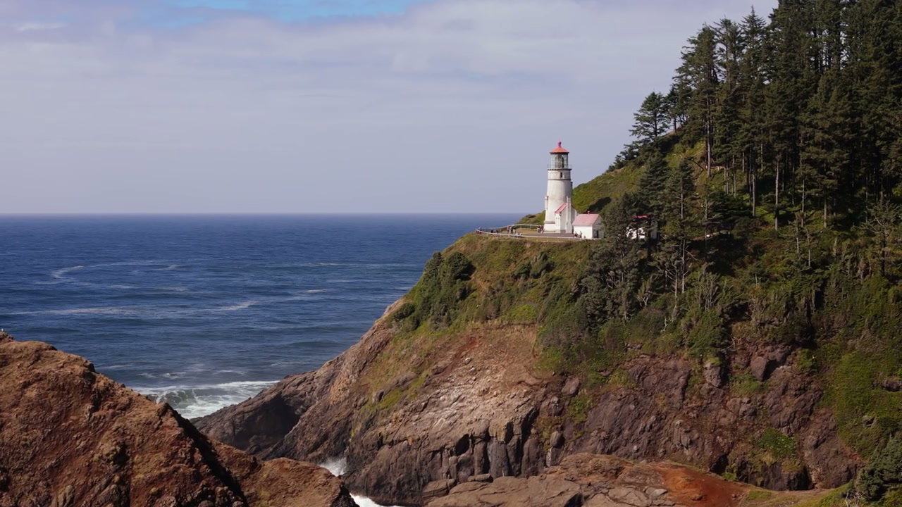 Pacific Coast Lighthouse on Rocky Cliff