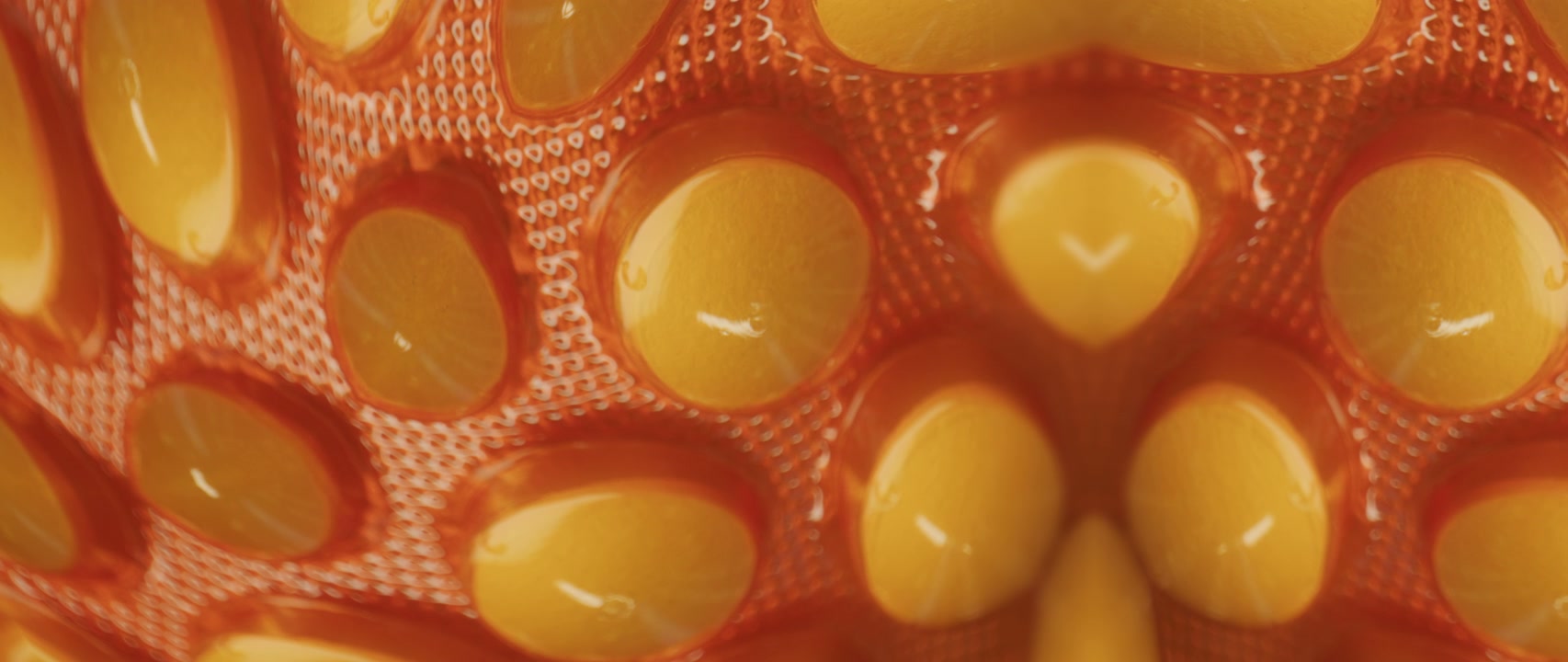 Mirrored View of Yellow Pills in Blister Pack