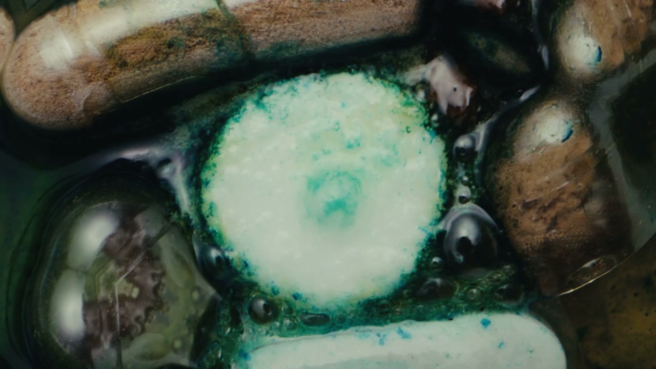 Colorful Pills Dissolving in Liquid