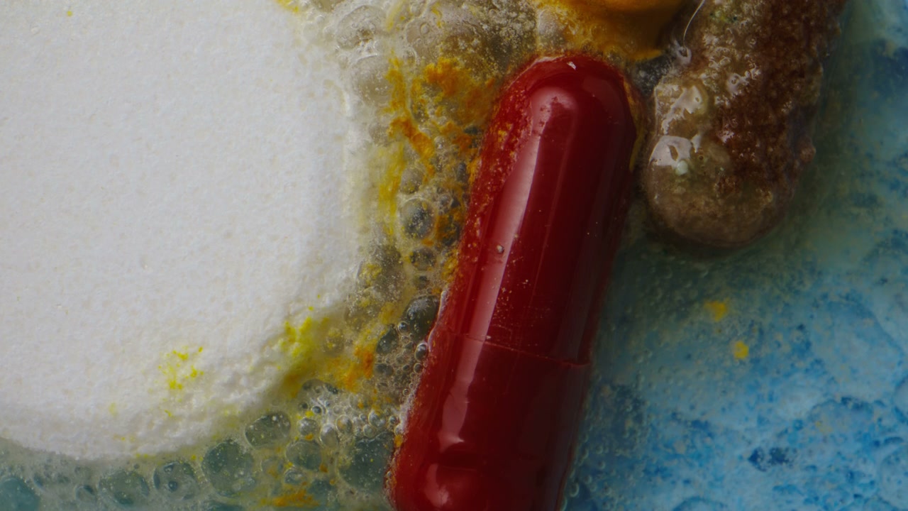 Colorful Pills Dissolving Macro Close-up