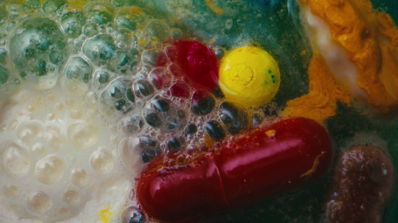 Colorful Pills and Powders Dissolving