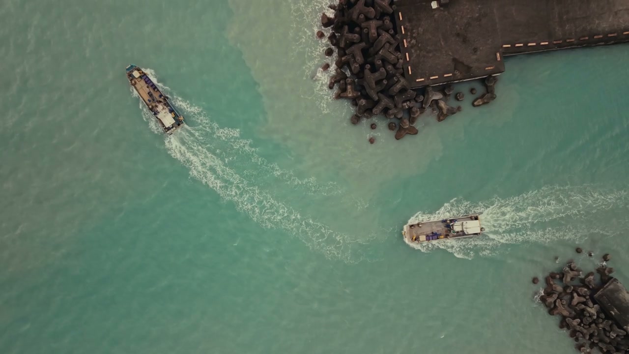 Two Boats Leaving Pier in Taiwan
