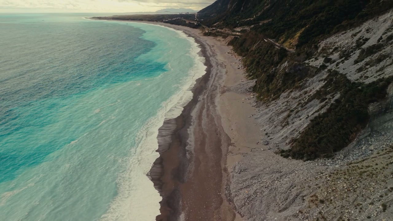 Aerial View of Turquoise Ocean Coastline