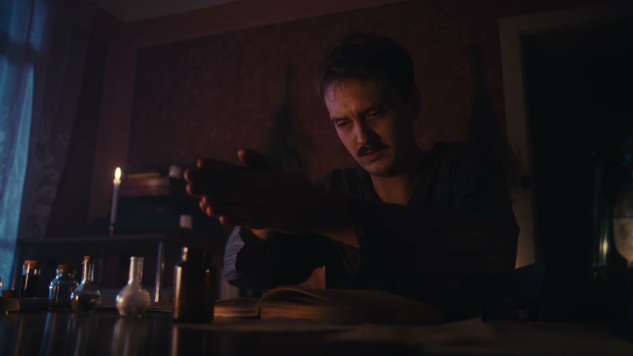 Man Performing Ancient Ritual by Candlelight