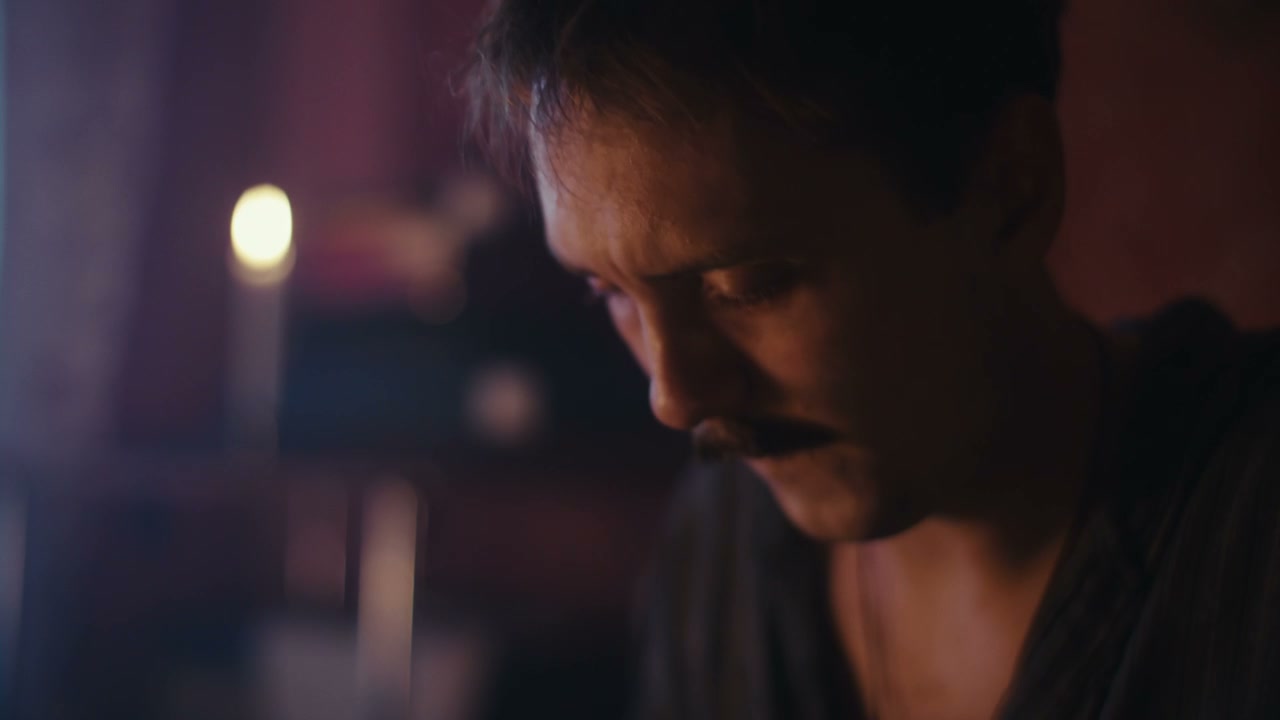 Pensive Man With Mustache in Dim Light