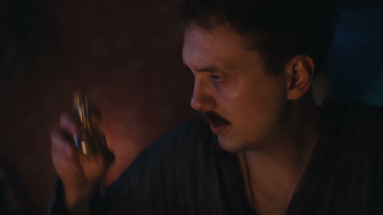 Man Examining Mysterious Vial