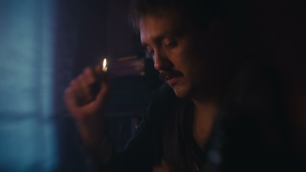 Man Concentrating by Candlelight