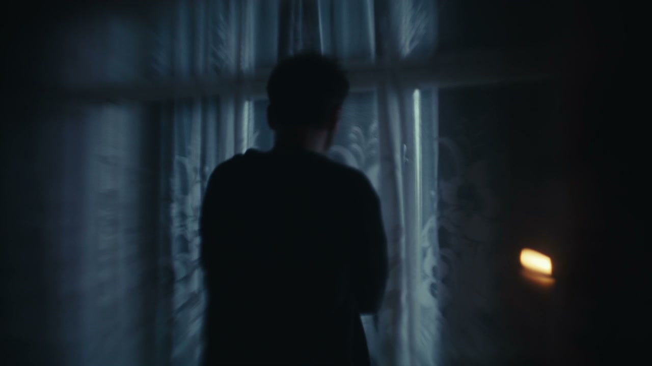 Moody Silhouette by Window at Night