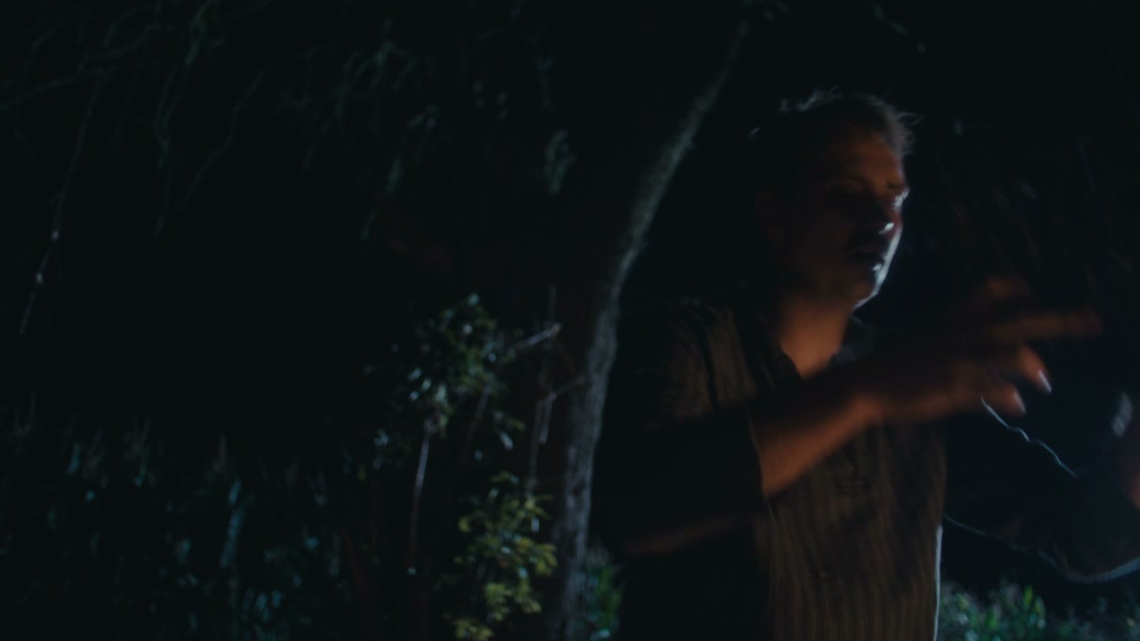 Man Performing Ritual at Night