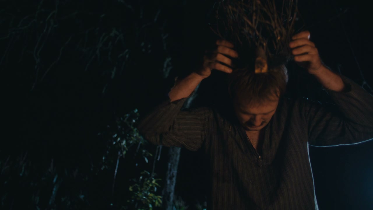 Man Performing Ancient Ritual at Night