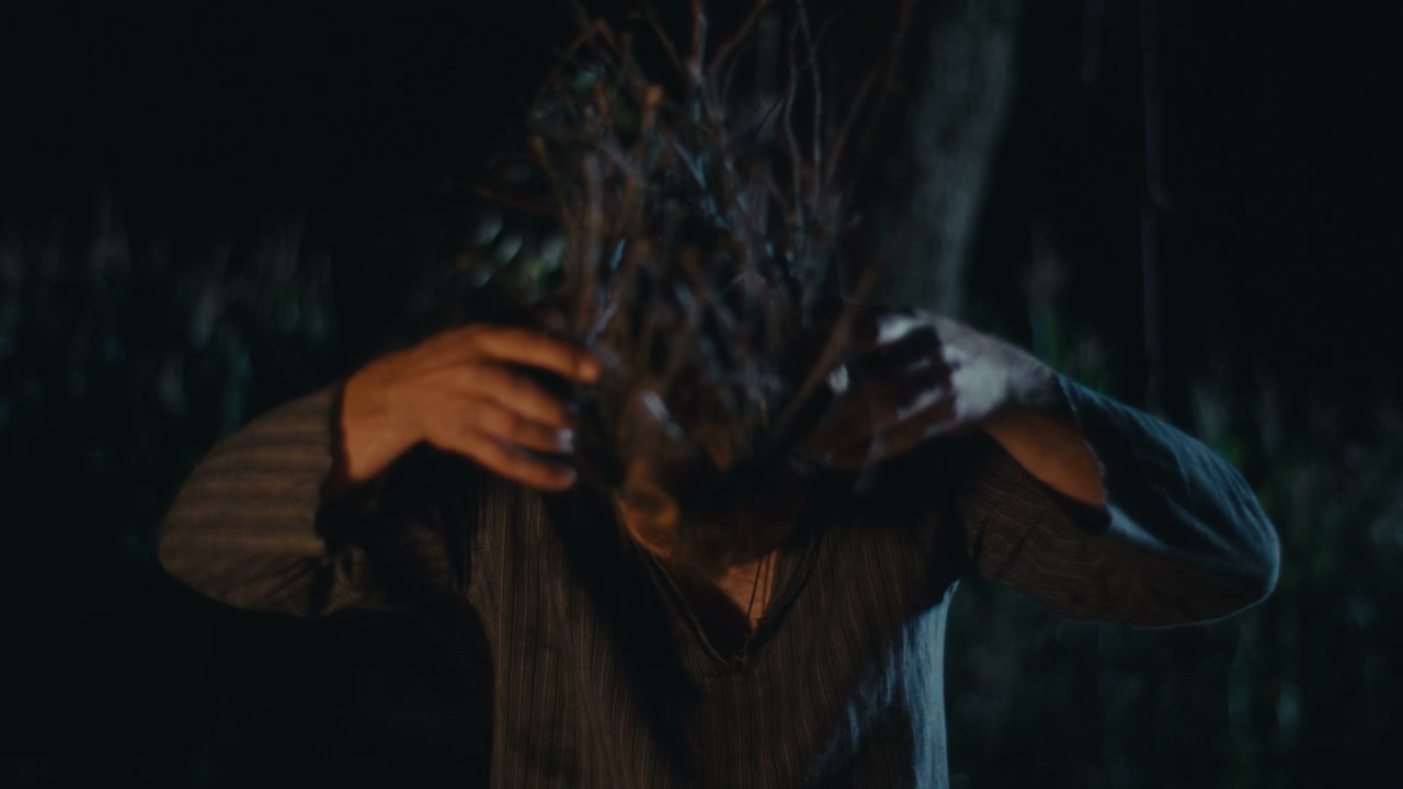 Man Performing Ritual with Twig Crown