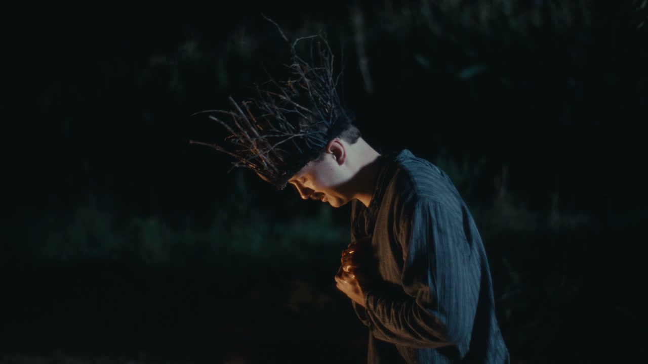 Man Performing Ritual With Twig Crown
