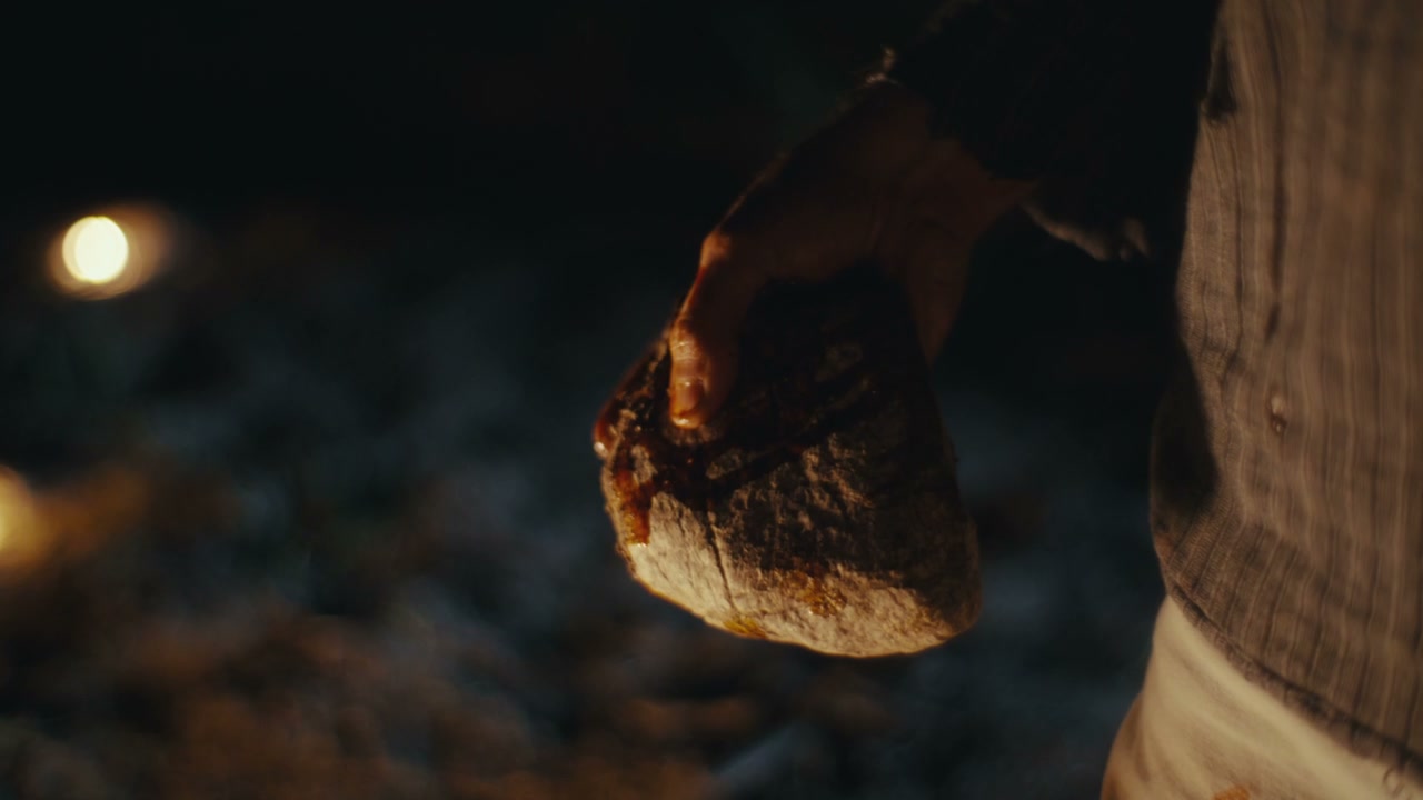 Hand Holding Dripping Ritual Object