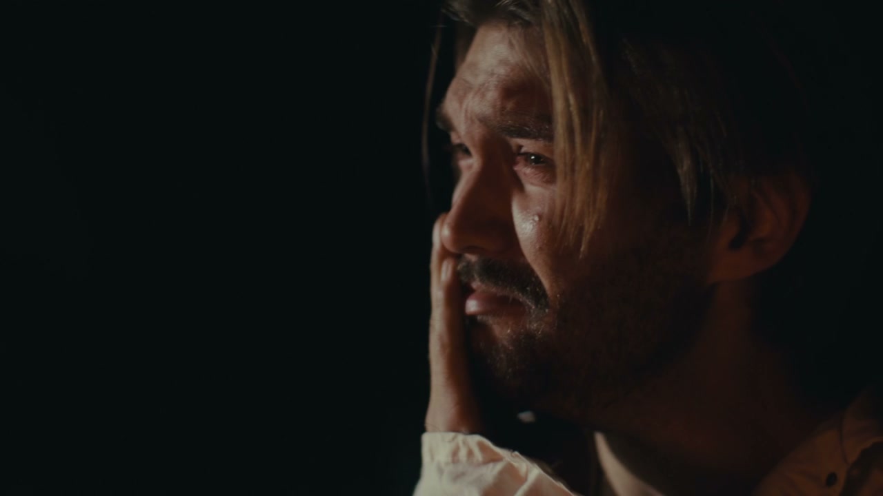 Man Crying Tears in Dramatic Low Light