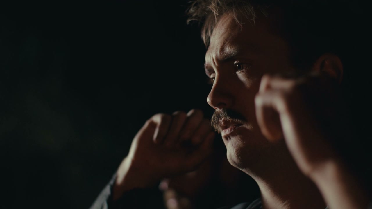 Man With Mustache Deep In Thought