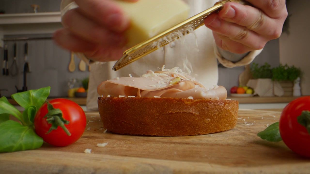 Grating Cheese onto a Gourmet Sandwich
