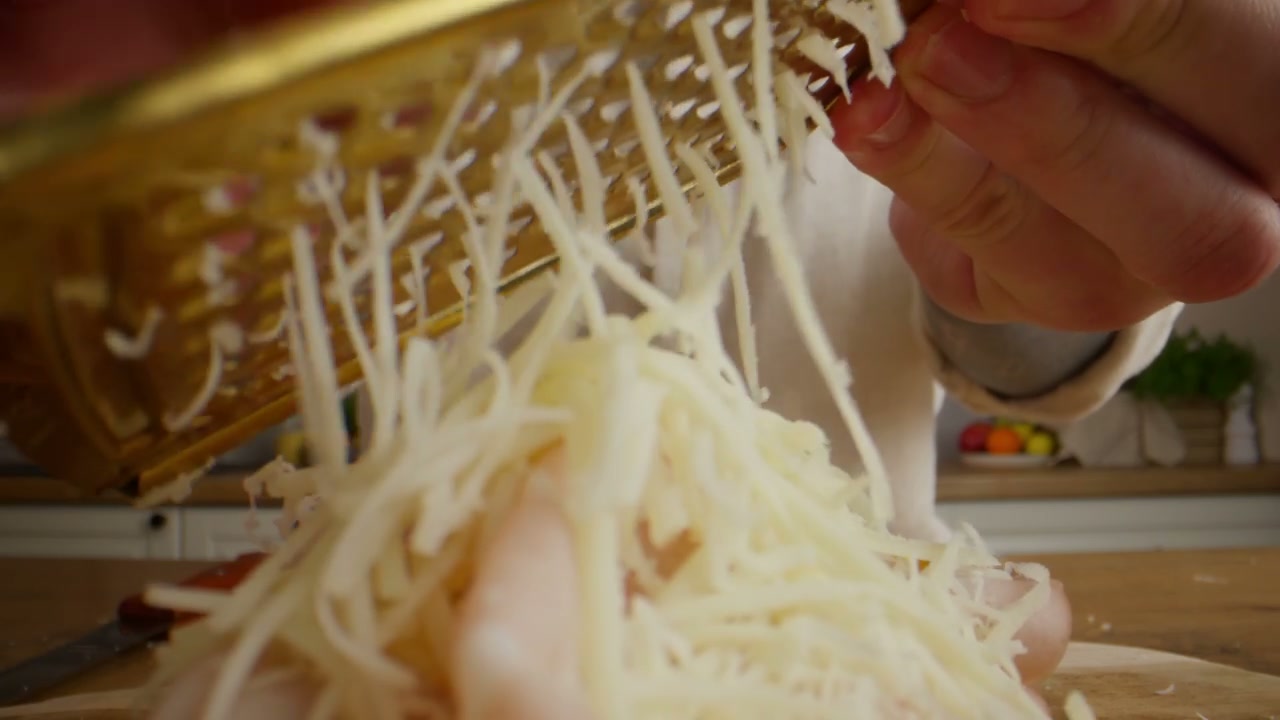 Hands Grating Cheese For Food Preparation