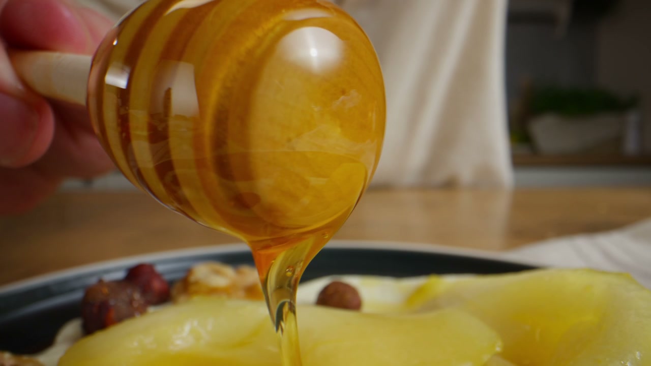 Honey Drizzling on Fruit Dessert