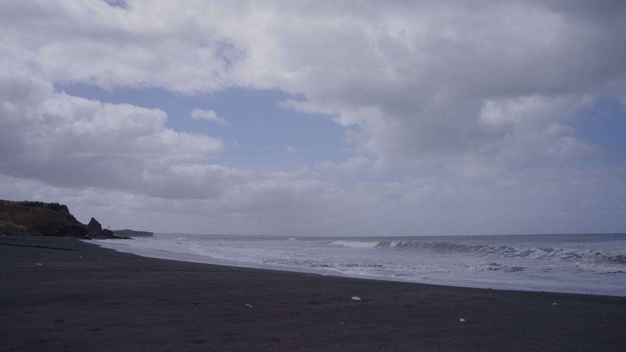 Black Sand Beach with Ocean Waves Timelapse