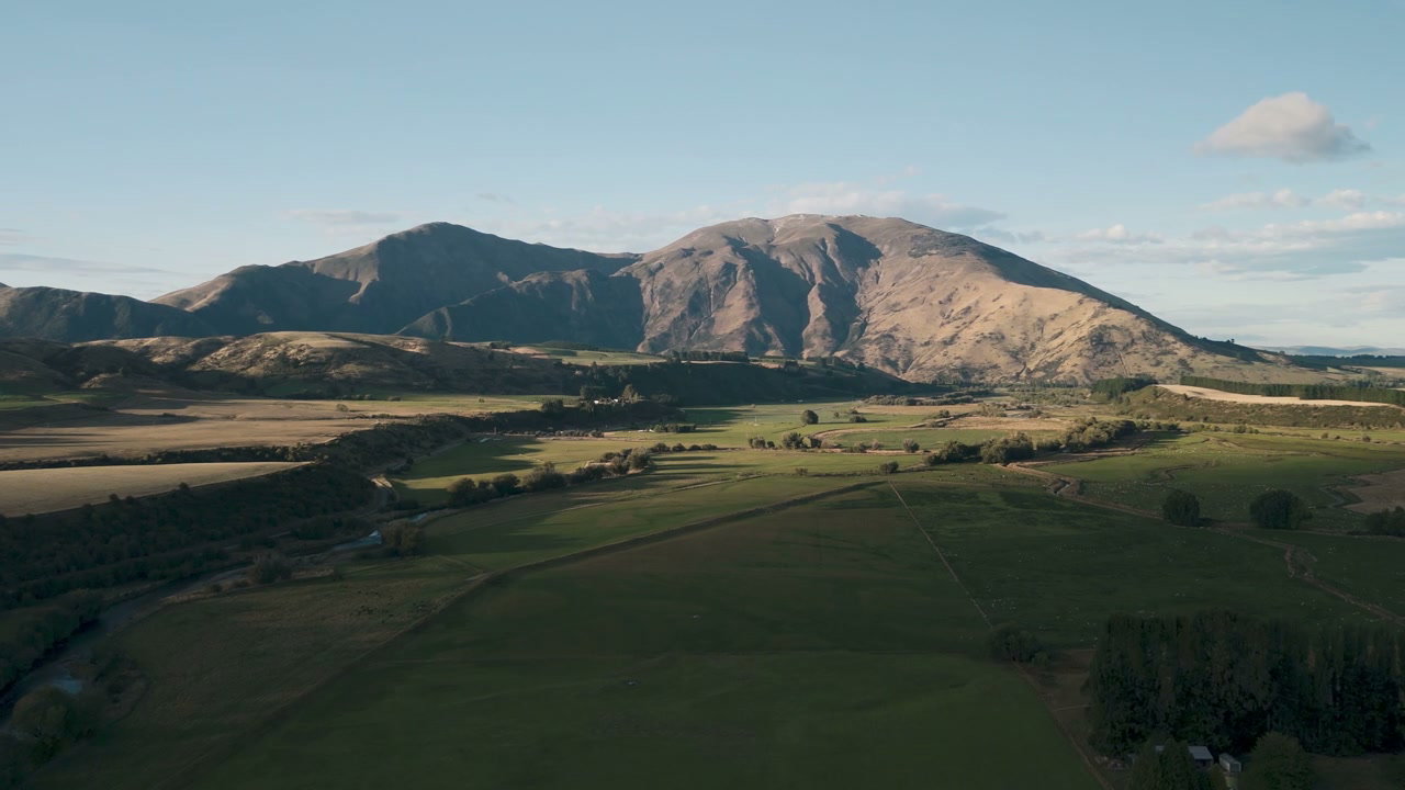 Vast Green Fields in a Mountain Valley