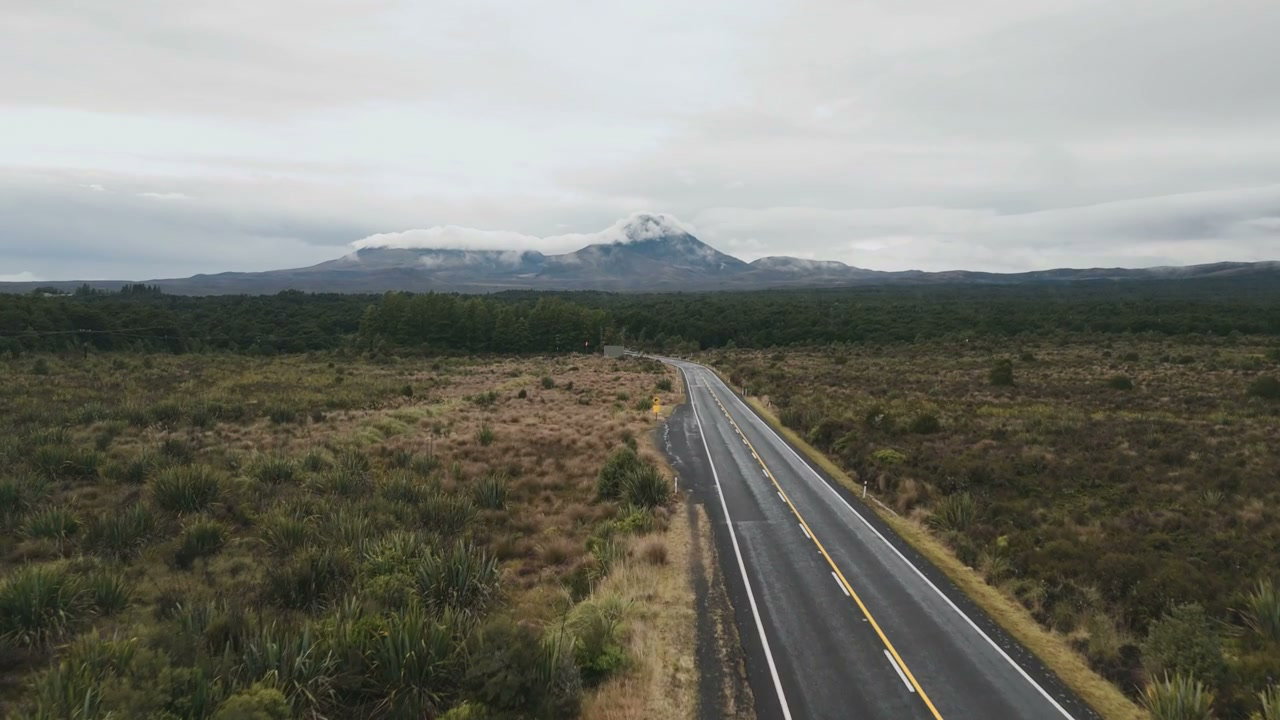 Empty Road Leading to Distant Mountain Landscape