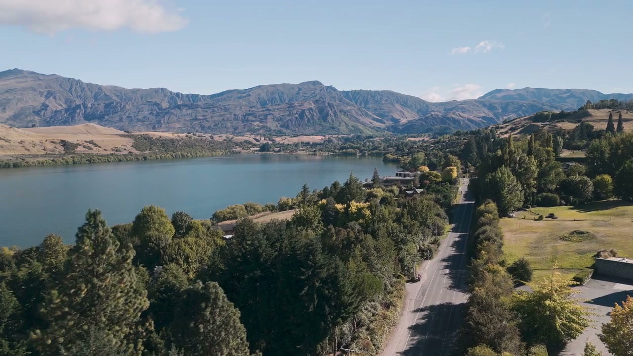 Scenic Lakeside Road With Mountains
