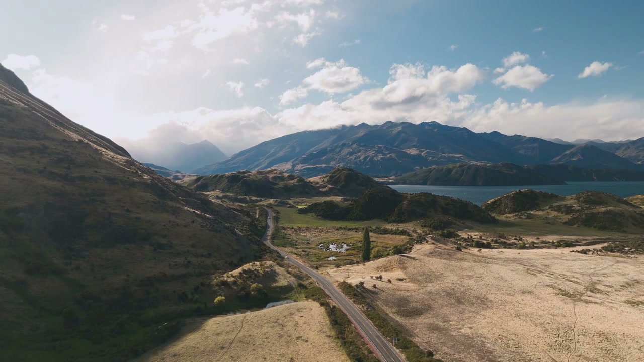 Winding Mountain Road Beside Lake