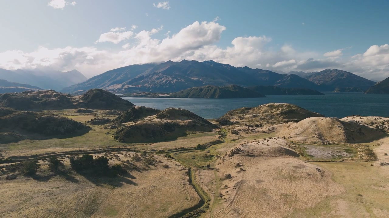 Mountain Lake and Rolling Hills Landscape