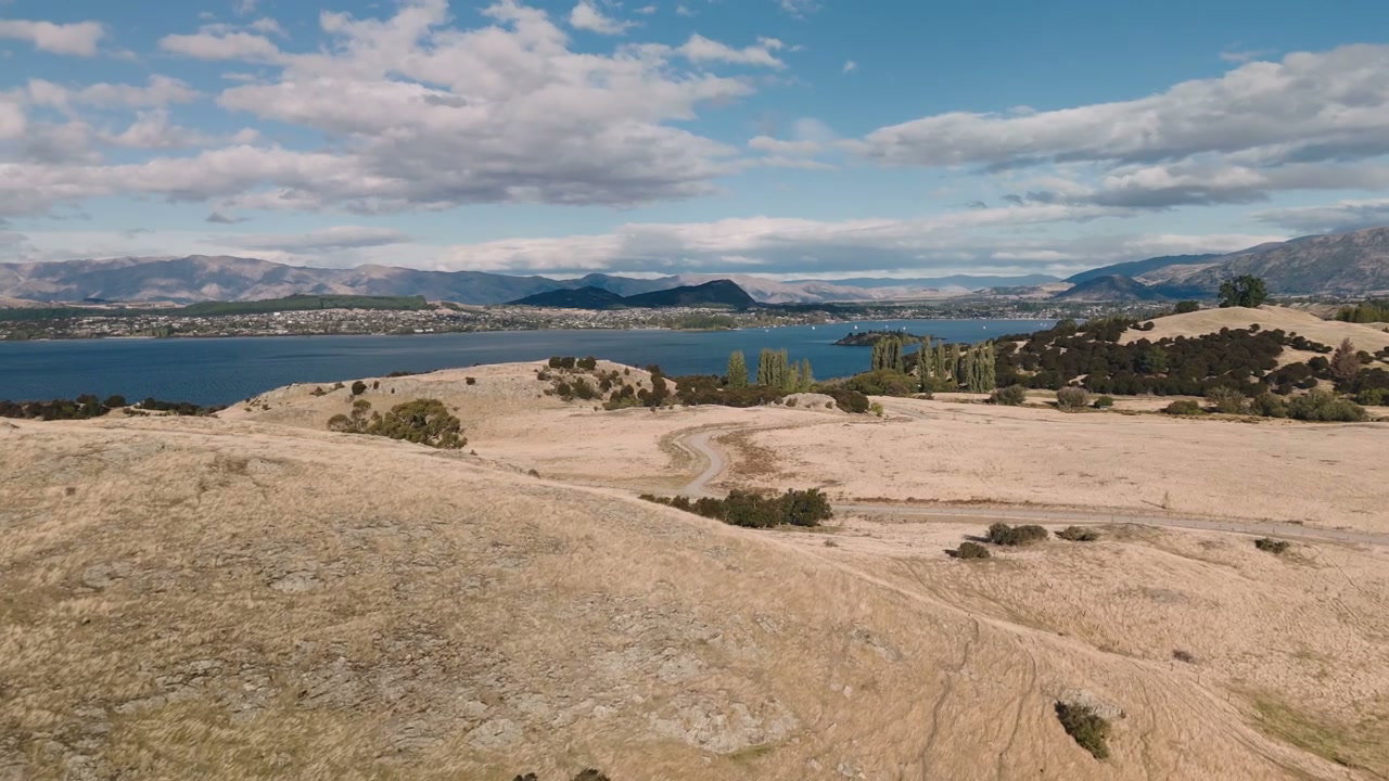 Scenic View of Lake and Golden Hills